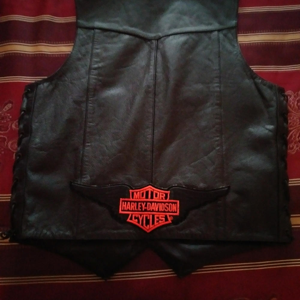 Set of 2. His and hers leather vests..new